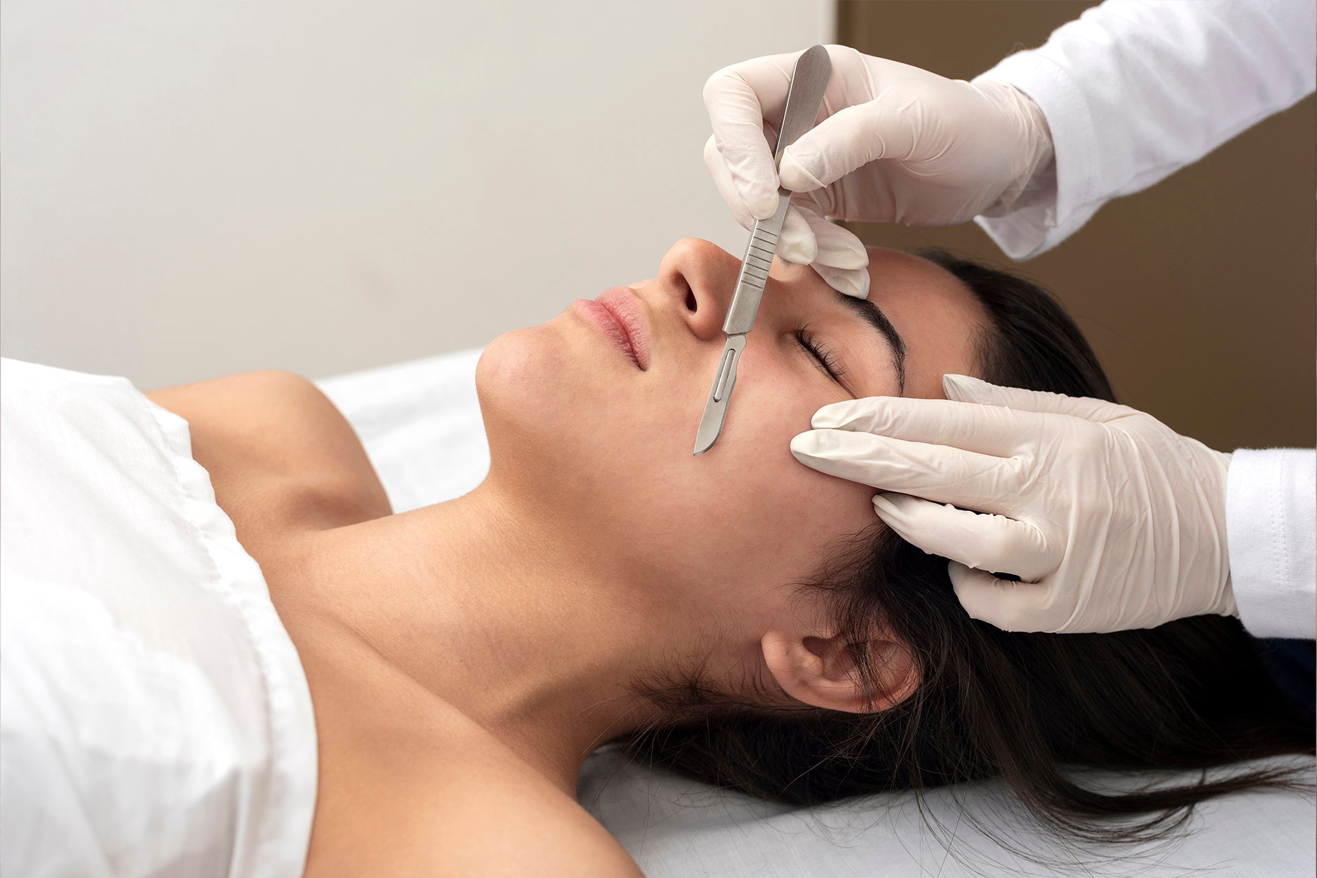 Dermaplaning facial exfoliation performed by a licensed aesthetic provider





