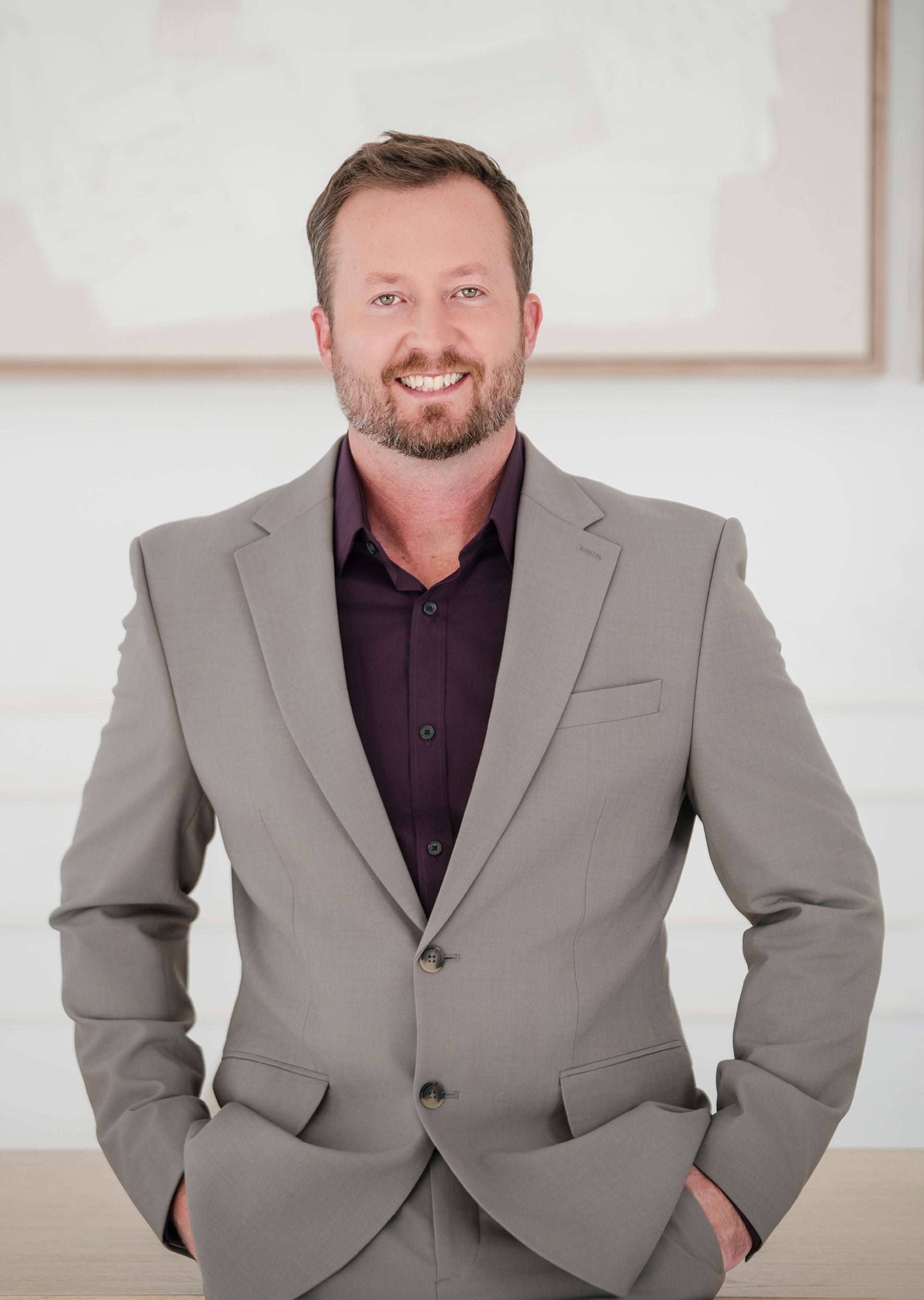 Man wearing a gray suit with a white background